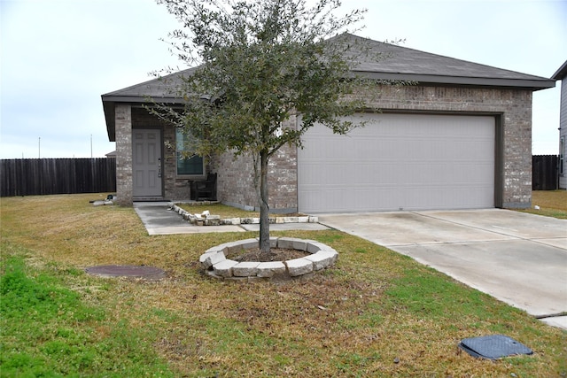 view of front of home featuring a garage and a front lawn