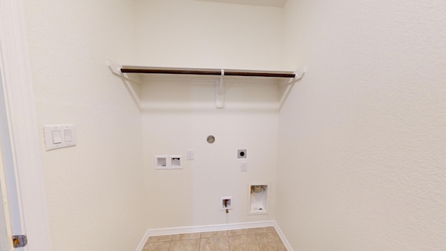 clothes washing area featuring hookup for a gas dryer, electric dryer hookup, and hookup for a washing machine