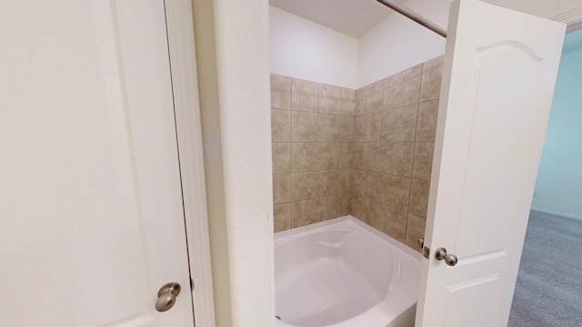 bathroom featuring washtub / shower combination