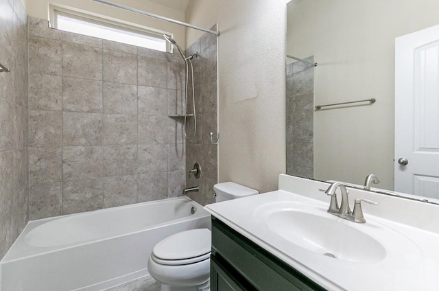 full bathroom featuring vanity, toilet, and tiled shower / bath combo