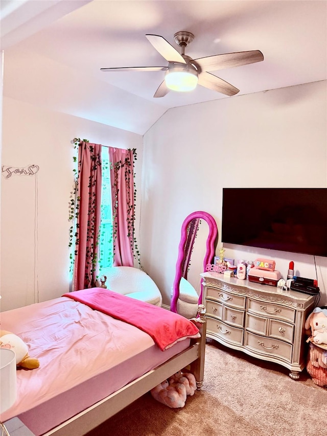 carpeted bedroom featuring lofted ceiling and ceiling fan