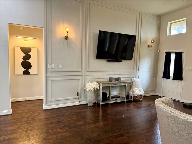 living room with dark hardwood / wood-style flooring