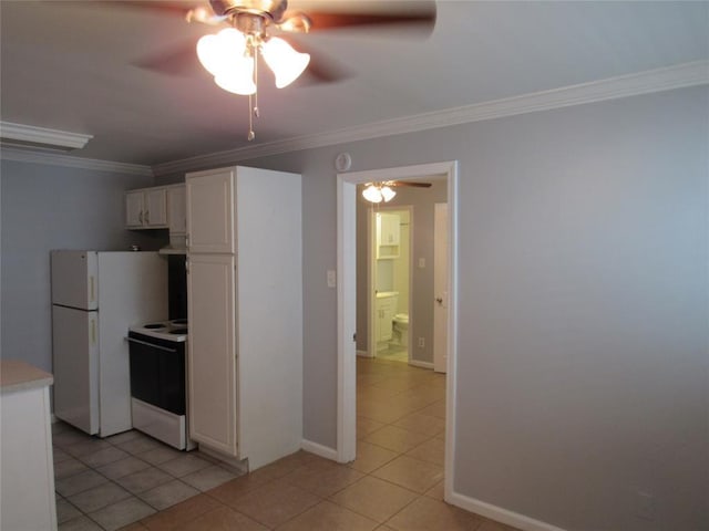 kitchen with ornamental molding, light tile patterned floors, white cabinets, and white appliances