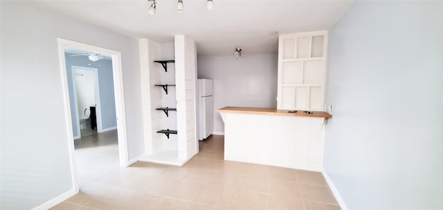 interior space with light tile patterned floors