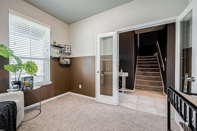 interior space featuring a healthy amount of sunlight, heating unit, and french doors