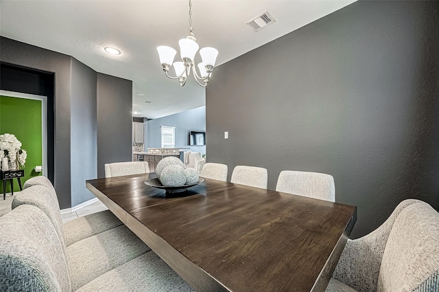 dining area featuring a chandelier