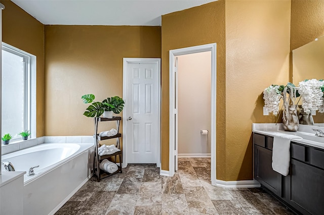 bathroom featuring vanity and a bathtub