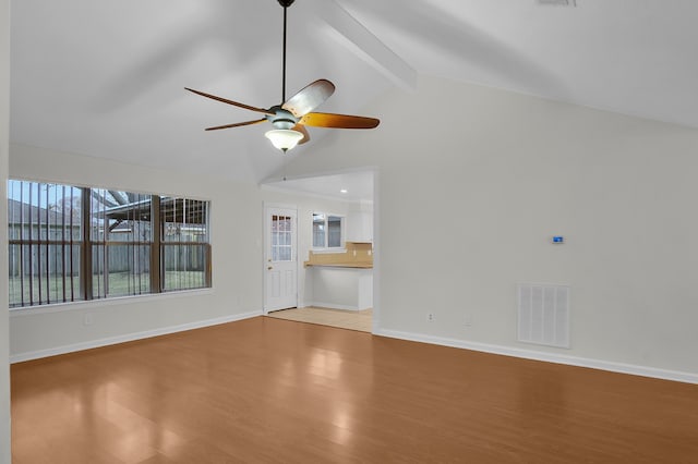 unfurnished living room featuring vaulted ceiling with beams, ceiling fan, and light wood-type flooring