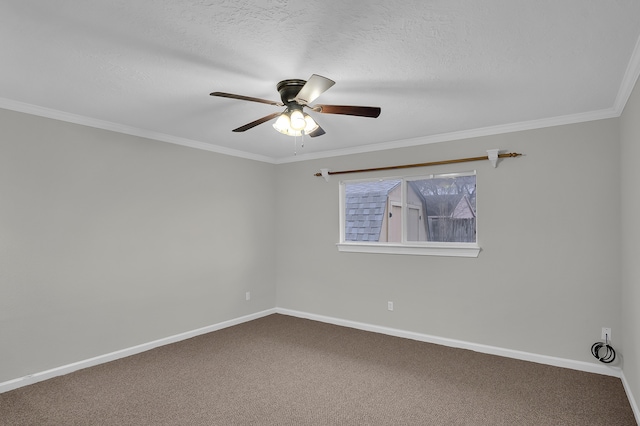 spare room with ceiling fan, ornamental molding, carpet floors, and a textured ceiling