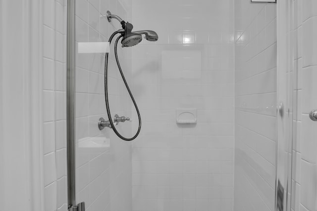 bathroom with a tile shower