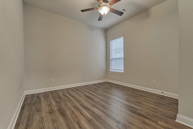 unfurnished room featuring ceiling fan and dark hardwood / wood-style flooring