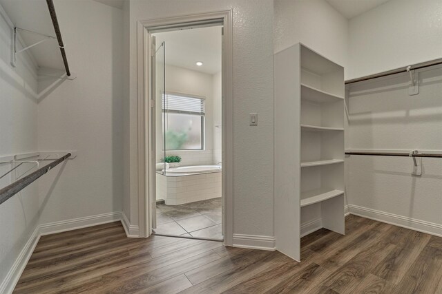 walk in closet featuring dark wood-type flooring