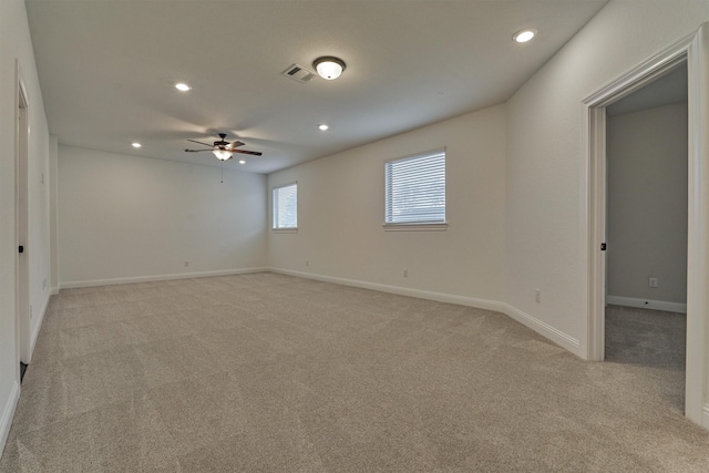 spare room featuring recessed lighting, visible vents, baseboards, and light colored carpet