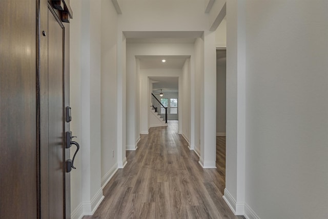 corridor with wood-type flooring