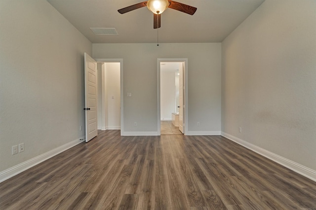 unfurnished bedroom with ceiling fan, connected bathroom, and dark hardwood / wood-style flooring