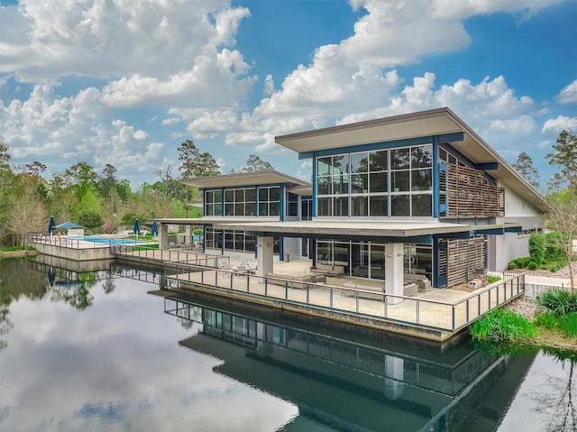 rear view of house with a water view