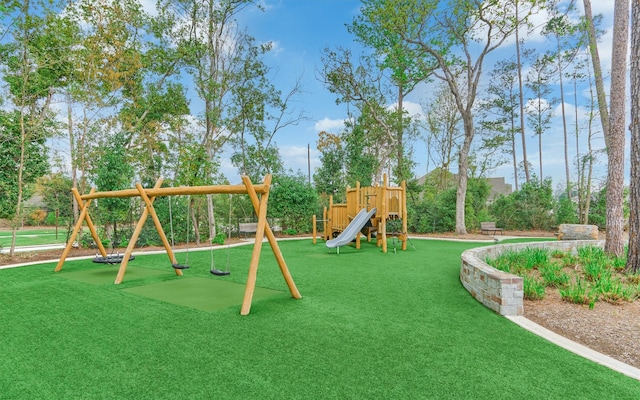 community playground featuring a lawn