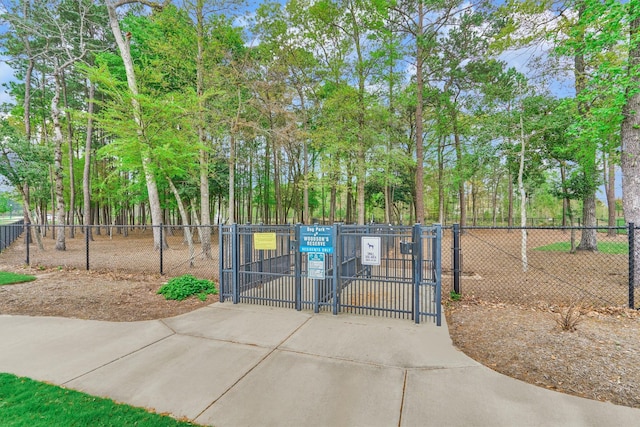 view of gate with fence