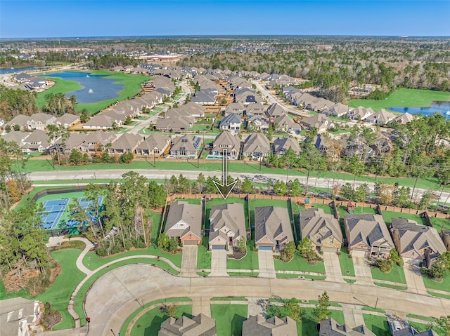 bird's eye view featuring a water view and a residential view