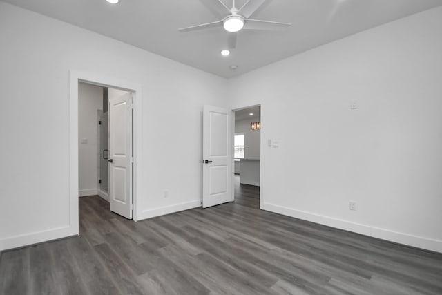 unfurnished bedroom featuring dark wood-type flooring and ceiling fan