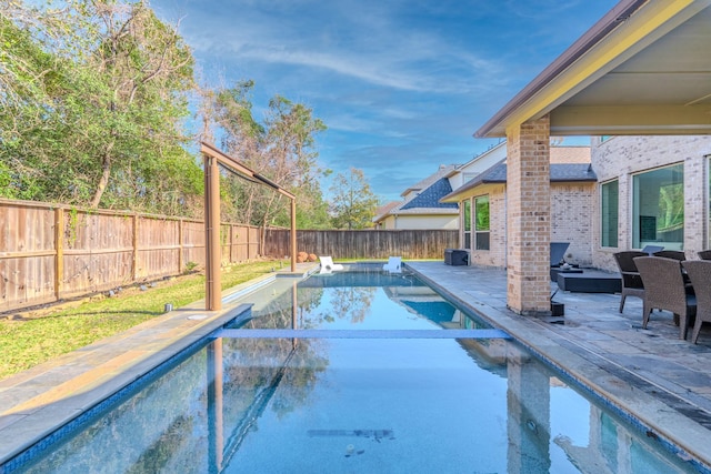 view of pool featuring a patio area