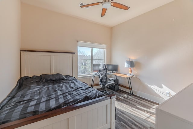 bedroom featuring hardwood / wood-style floors and ceiling fan