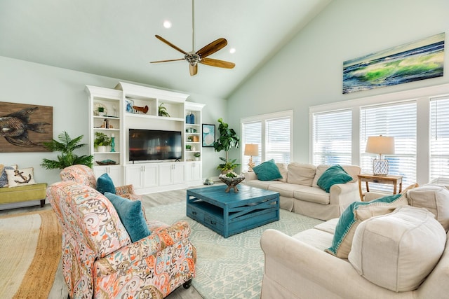 living room with ceiling fan, high vaulted ceiling, and light hardwood / wood-style floors