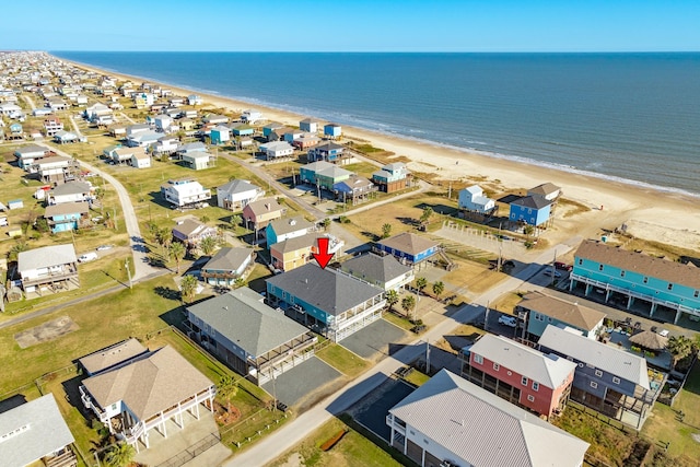 drone / aerial view with a view of the beach and a water view