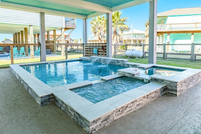 view of swimming pool featuring an in ground hot tub and pool water feature