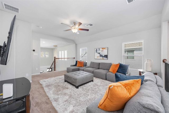 living room featuring light carpet and ceiling fan