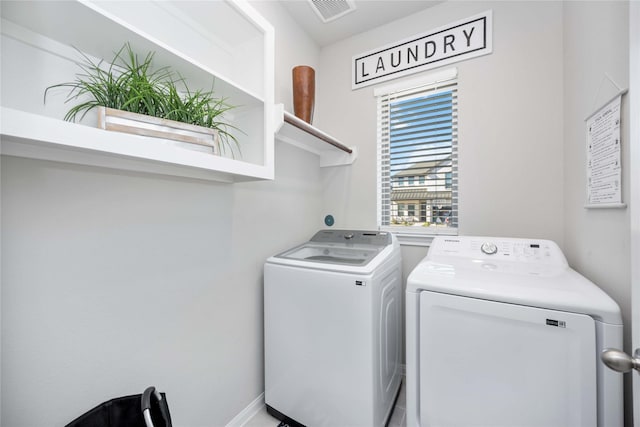 washroom with washer and dryer