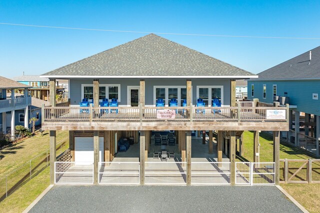 rear view of house featuring a garage