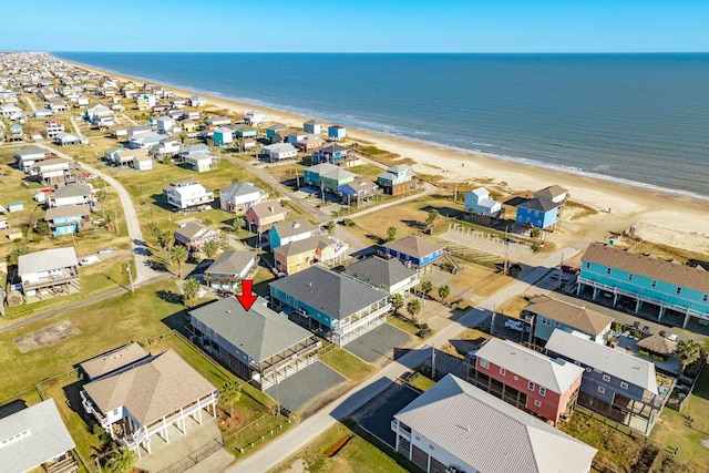 bird's eye view featuring a view of the beach and a water view