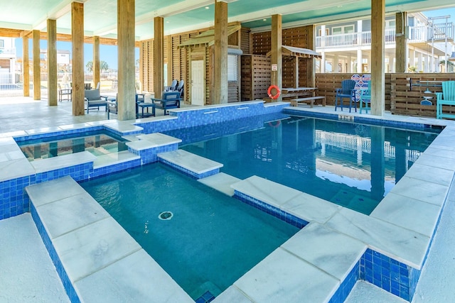 view of swimming pool featuring an indoor in ground hot tub