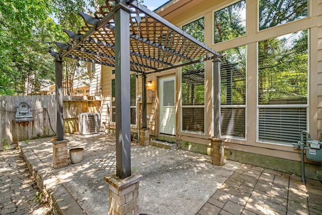 view of patio / terrace with a pergola and central air condition unit