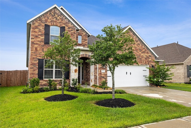 view of front of home featuring a garage and a front lawn