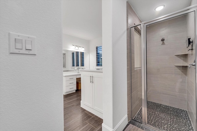 bathroom with vanity and an enclosed shower