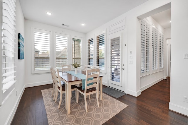 dining area featuring dark hardwood / wood-style floors