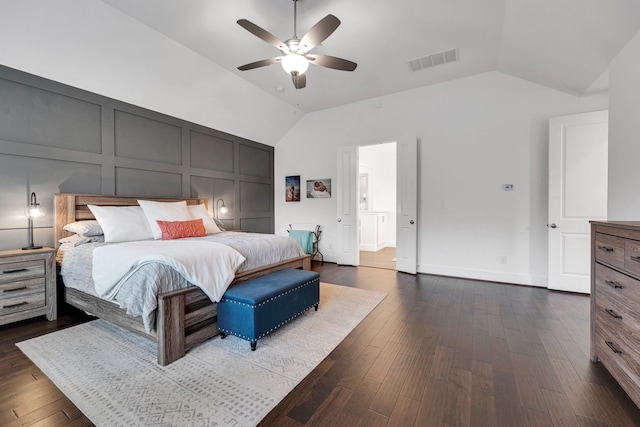 bedroom with vaulted ceiling, dark wood-type flooring, and ceiling fan