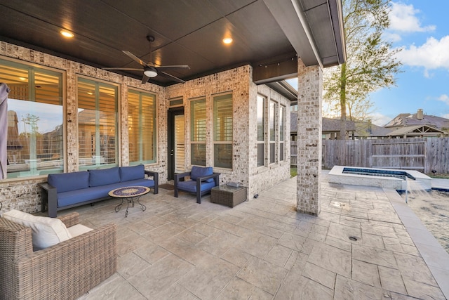 view of patio with an outdoor hangout area and ceiling fan