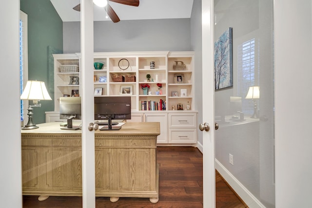 office area with dark wood-type flooring and ceiling fan