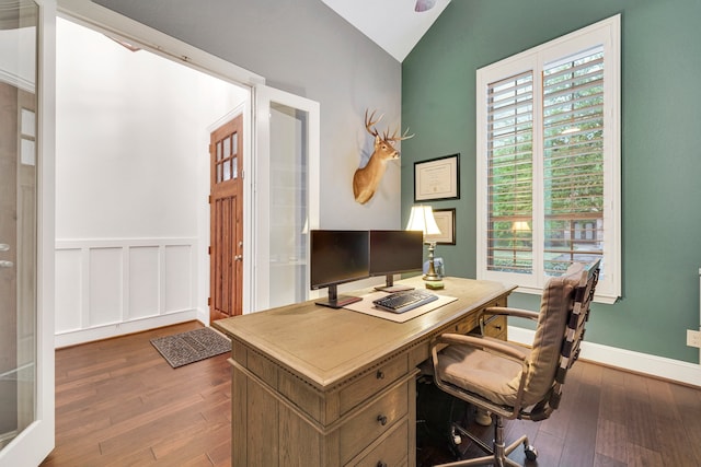 office featuring vaulted ceiling and wood-type flooring