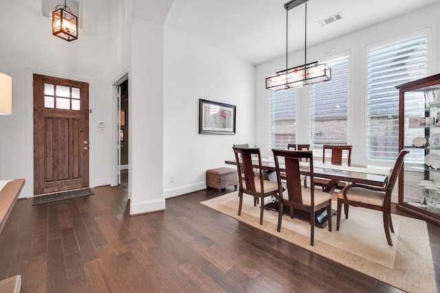 dining room with dark hardwood / wood-style floors