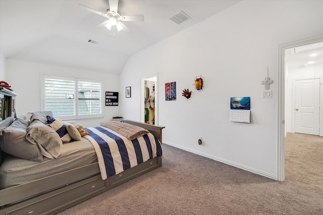 carpeted bedroom with vaulted ceiling and ceiling fan