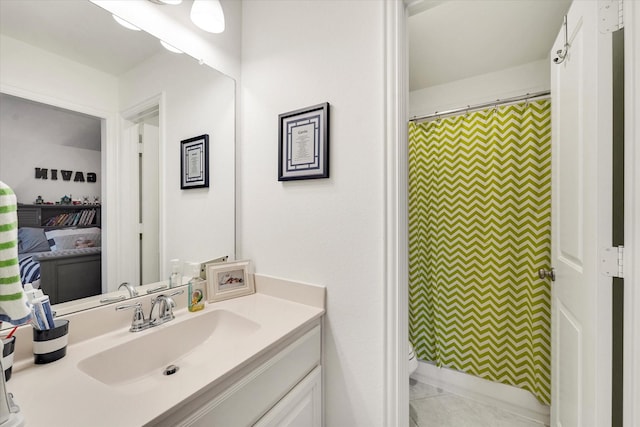 bathroom with tile patterned floors and vanity