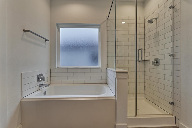 bathroom featuring plus walk in shower