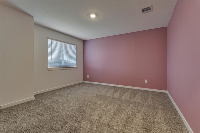 empty room with carpet flooring