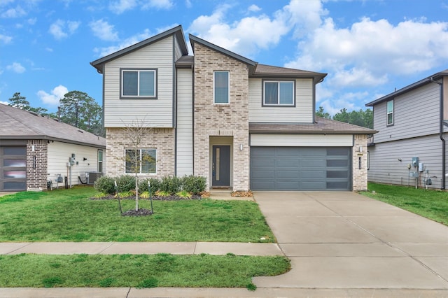 view of front of home featuring a garage and a front lawn