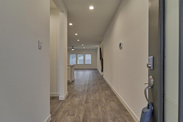 corridor featuring wood-type flooring