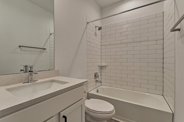 full bathroom featuring vanity, toilet, and tiled shower / bath combo